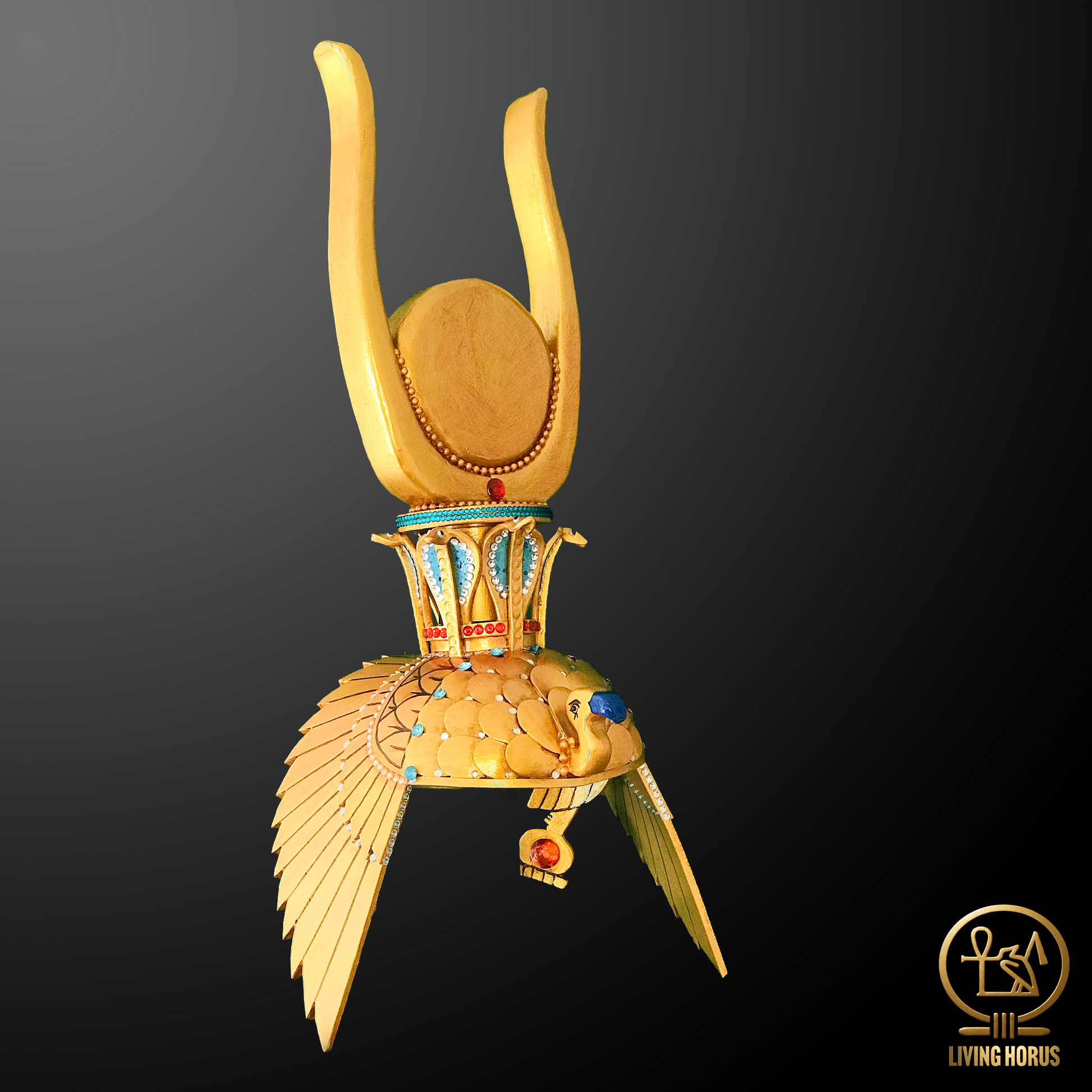 Gold headdress with wings on a black background, featuring the Living Horus logo.