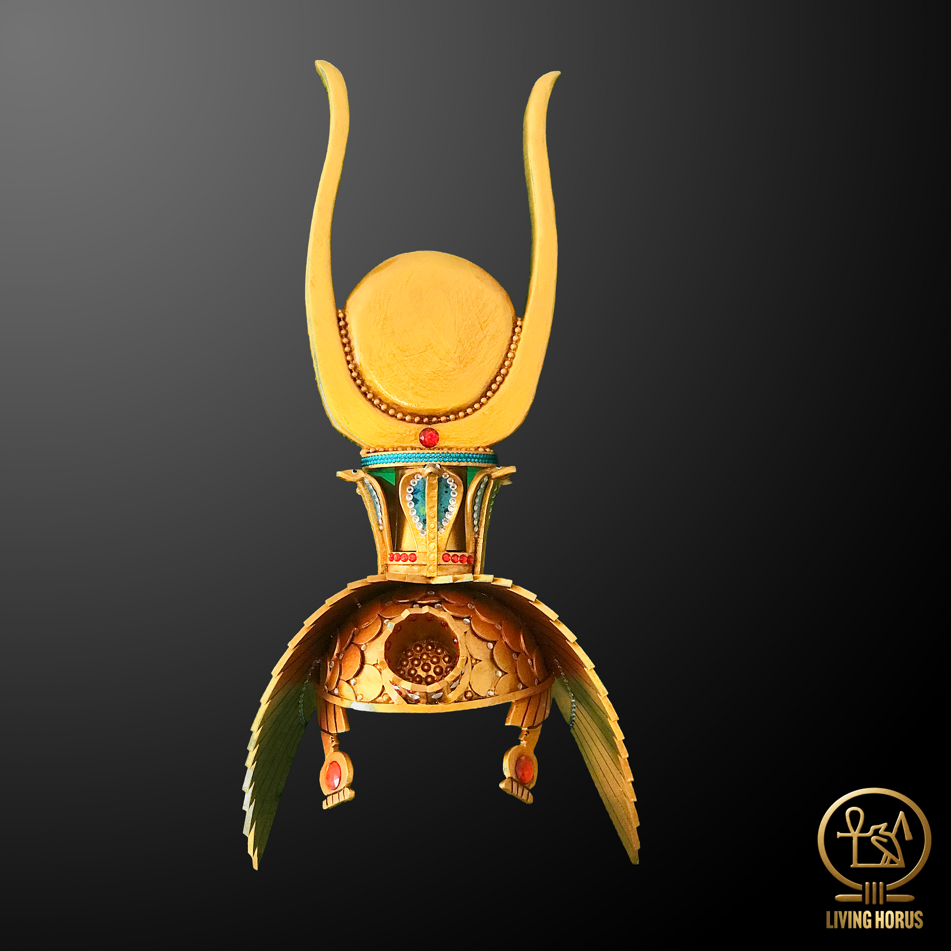 Decorative headdress with gold and green elements on a black background