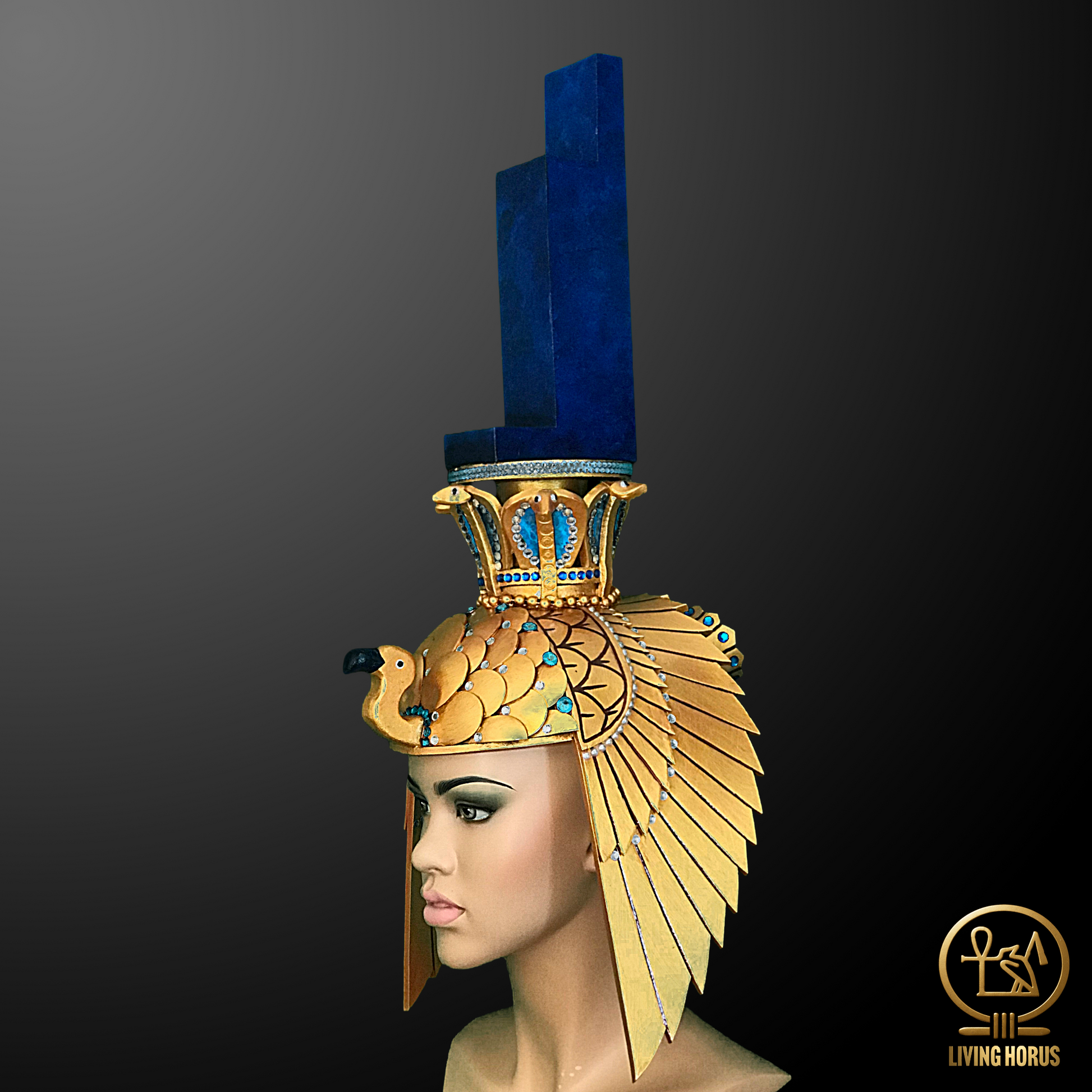 Gold and blue Egyptian-style headdress on a mannequin head against a dark background