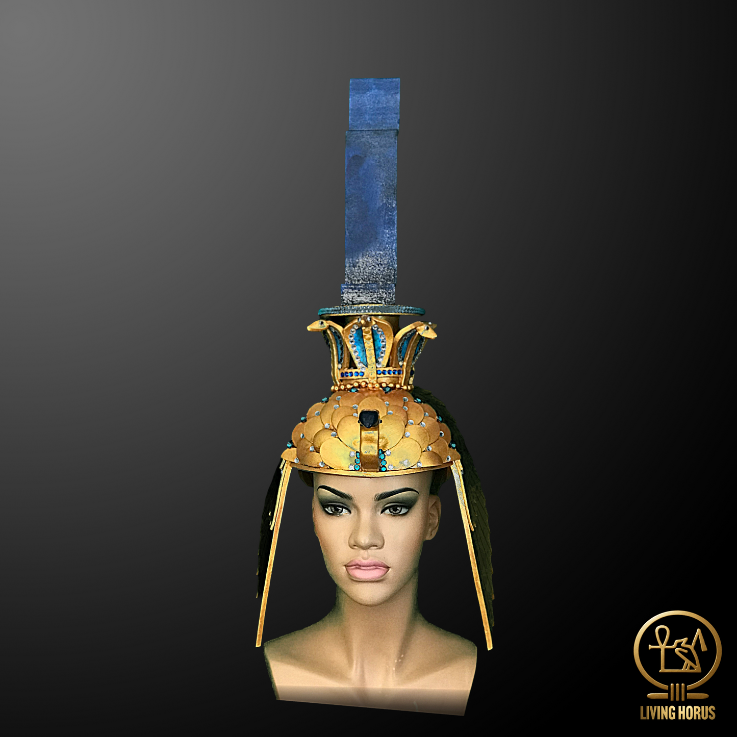Mannequin head wearing an ornate Egyptian-style headdress with a dark background